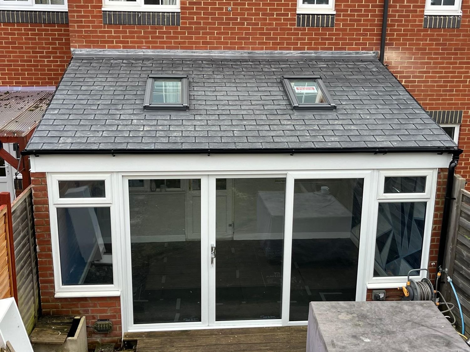 Lean-to with a tiled roof and two roof windows